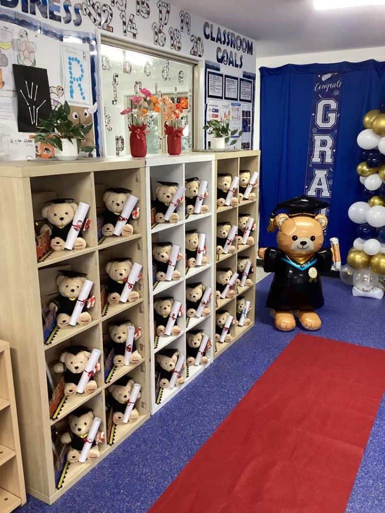 Teddy bears in graduation caps and gowns ready for the children's graduation