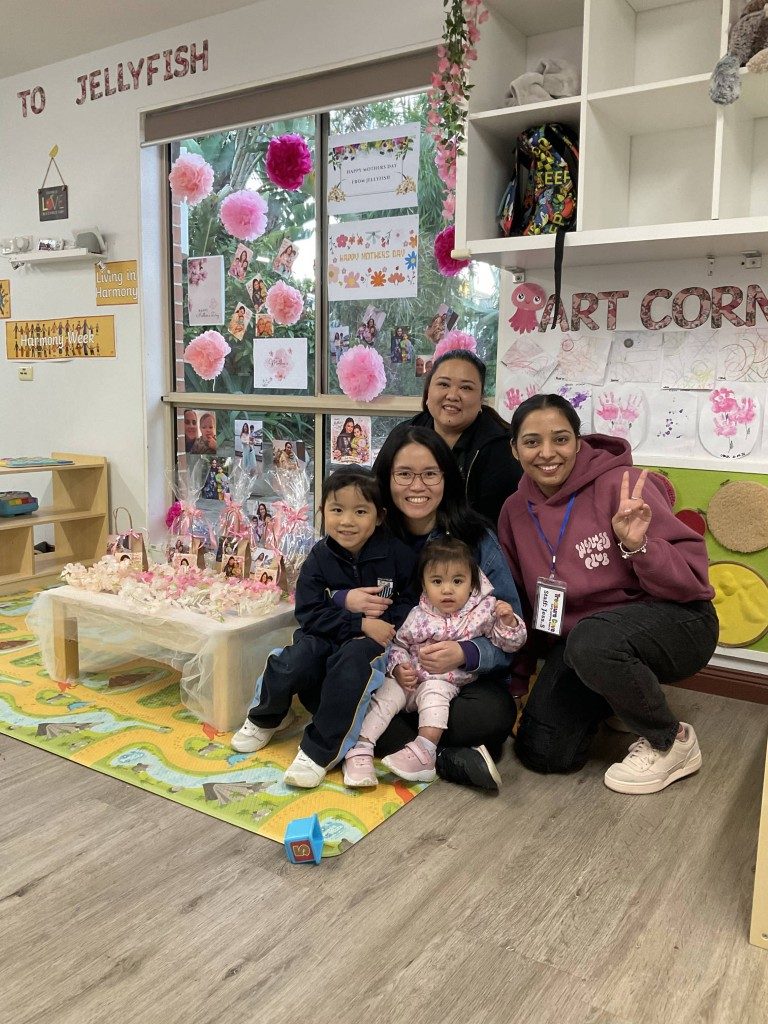 Mums and children celebrating Mother's Day together in the classroom
